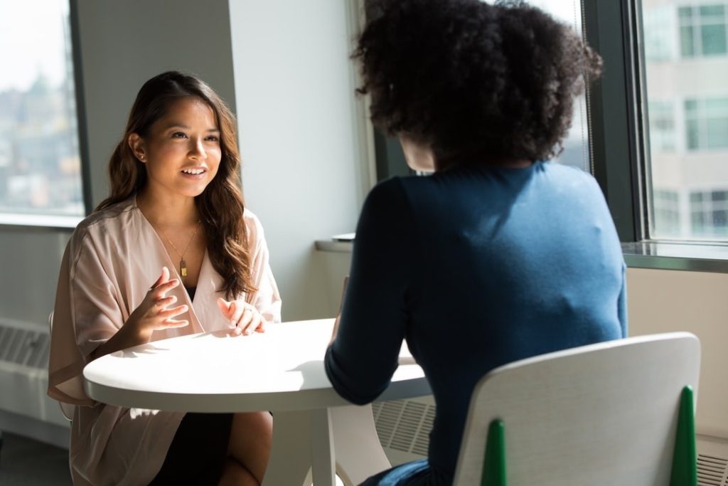 Two women discussing